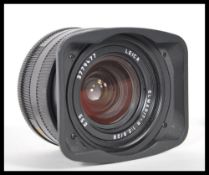 A Leitz Leica Elmarit-R 1:2.8/28 E55 Lens, serial no. 3779477, black, with Leitz Leica cap and
