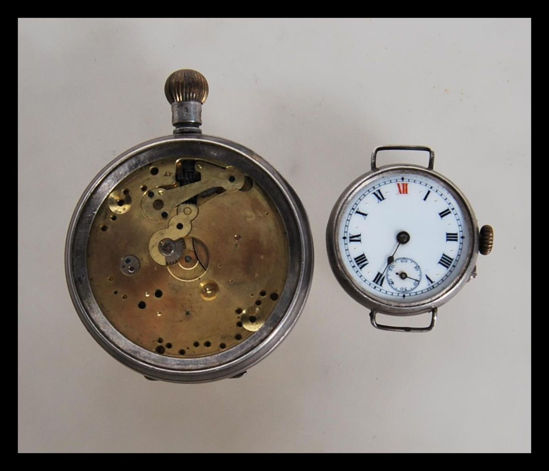 A 20th Century silver cased Thomas Russell & Son Liverpool pocket watch movement along with an early