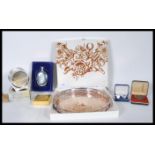 A collection of silver plated items to include a Viners fret pierced gallery tray, coasters, hip