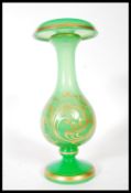 A 19th Century Victorian glass vase, having green opaline ground with gold gilt scroll and floral