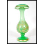 A 19th Century Victorian glass vase, having green opaline ground with gold gilt scroll and floral