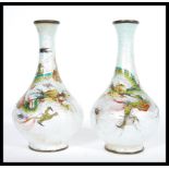 A pair of early 20th Century Chinese cloisonne vases having enamelled decoration of Chinese