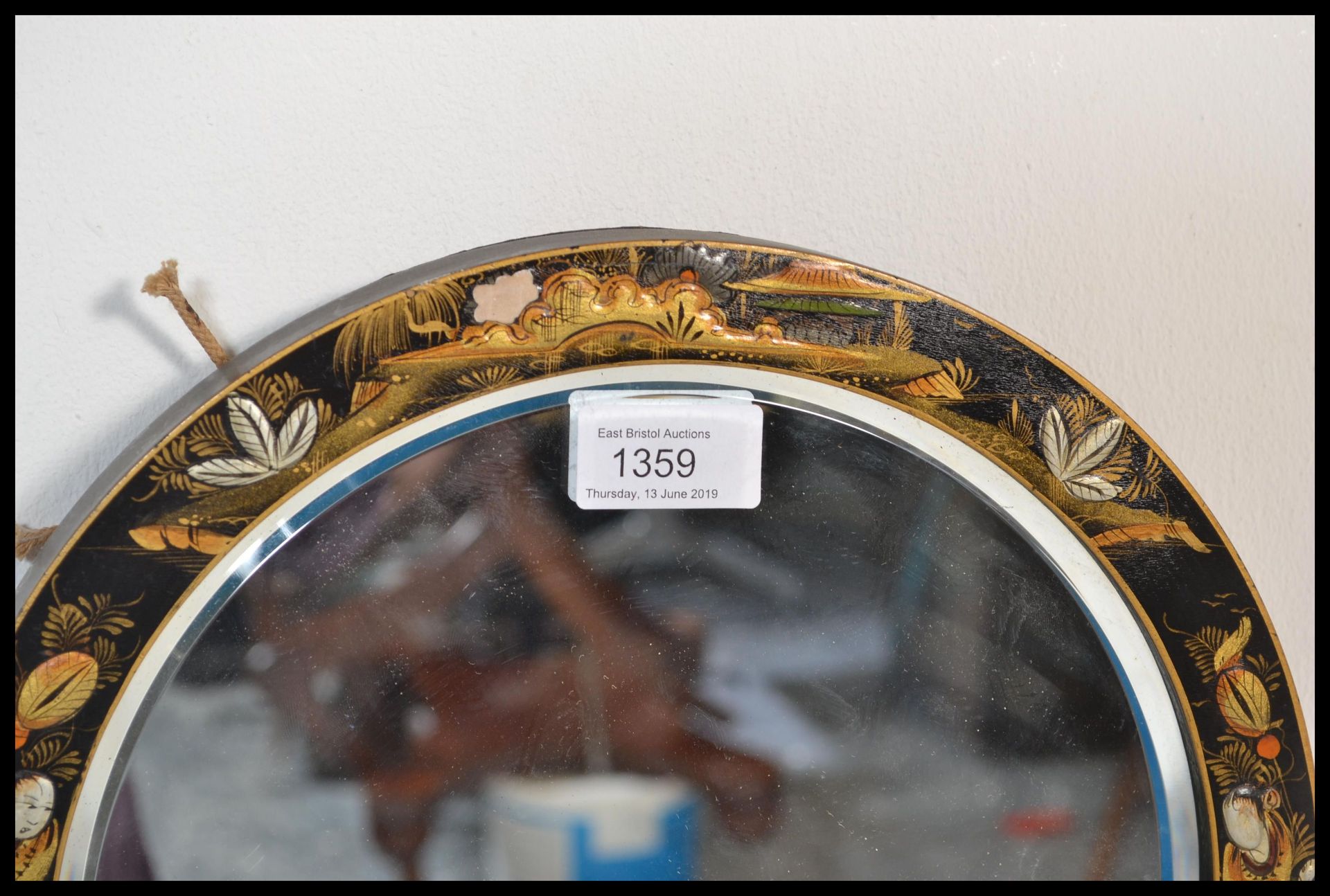 A early 20th Century 1920's Japanese chinoiserie lacquered circular bevelled edge wall mirror,