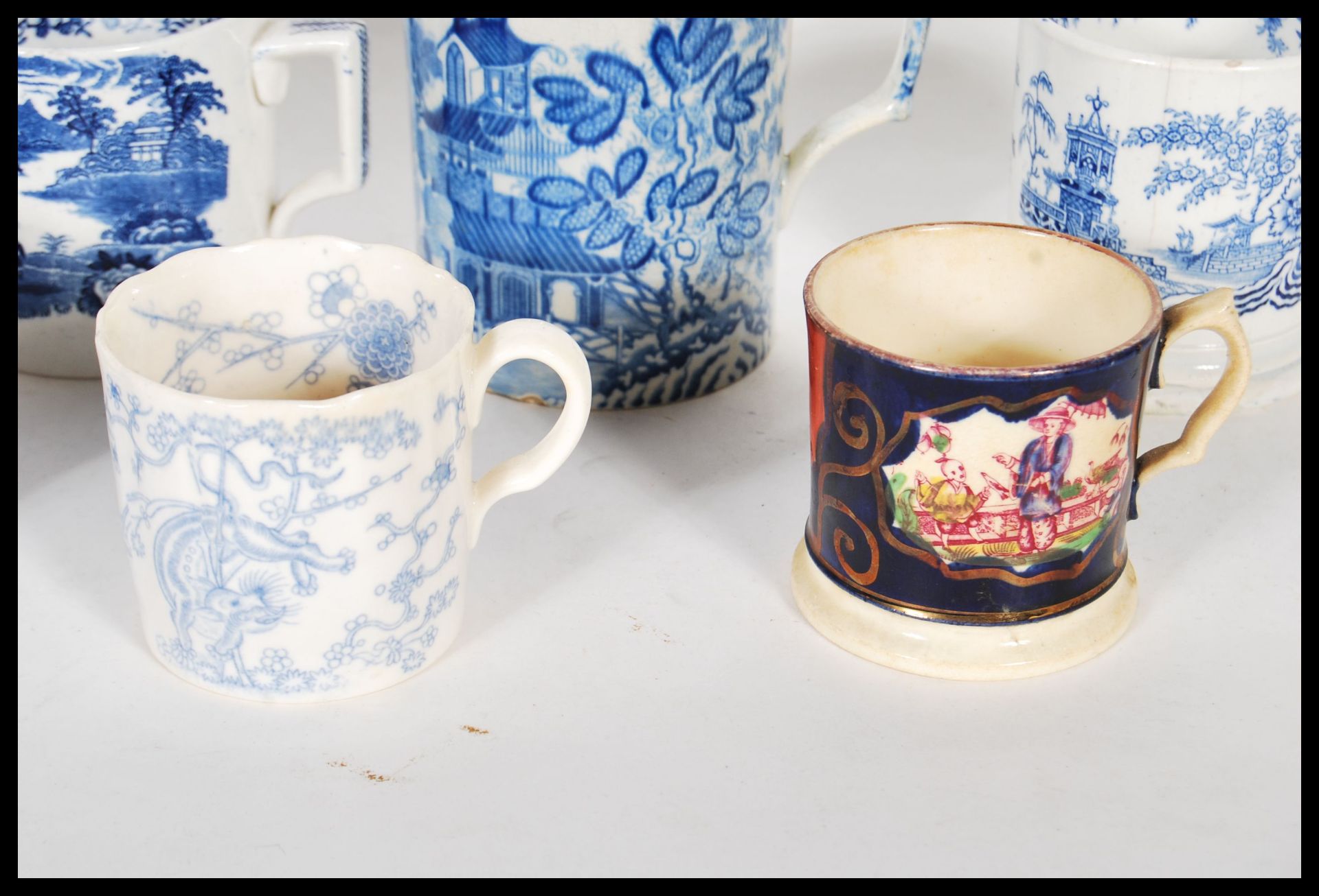 A collection of 19th Century Victorian Staffordshire mugs and cups, most having blue and white - Bild 3 aus 13