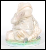 A 20th Century believed Beswick prototype ceramic figure of jeremy Fisher sitting on a lillypad.