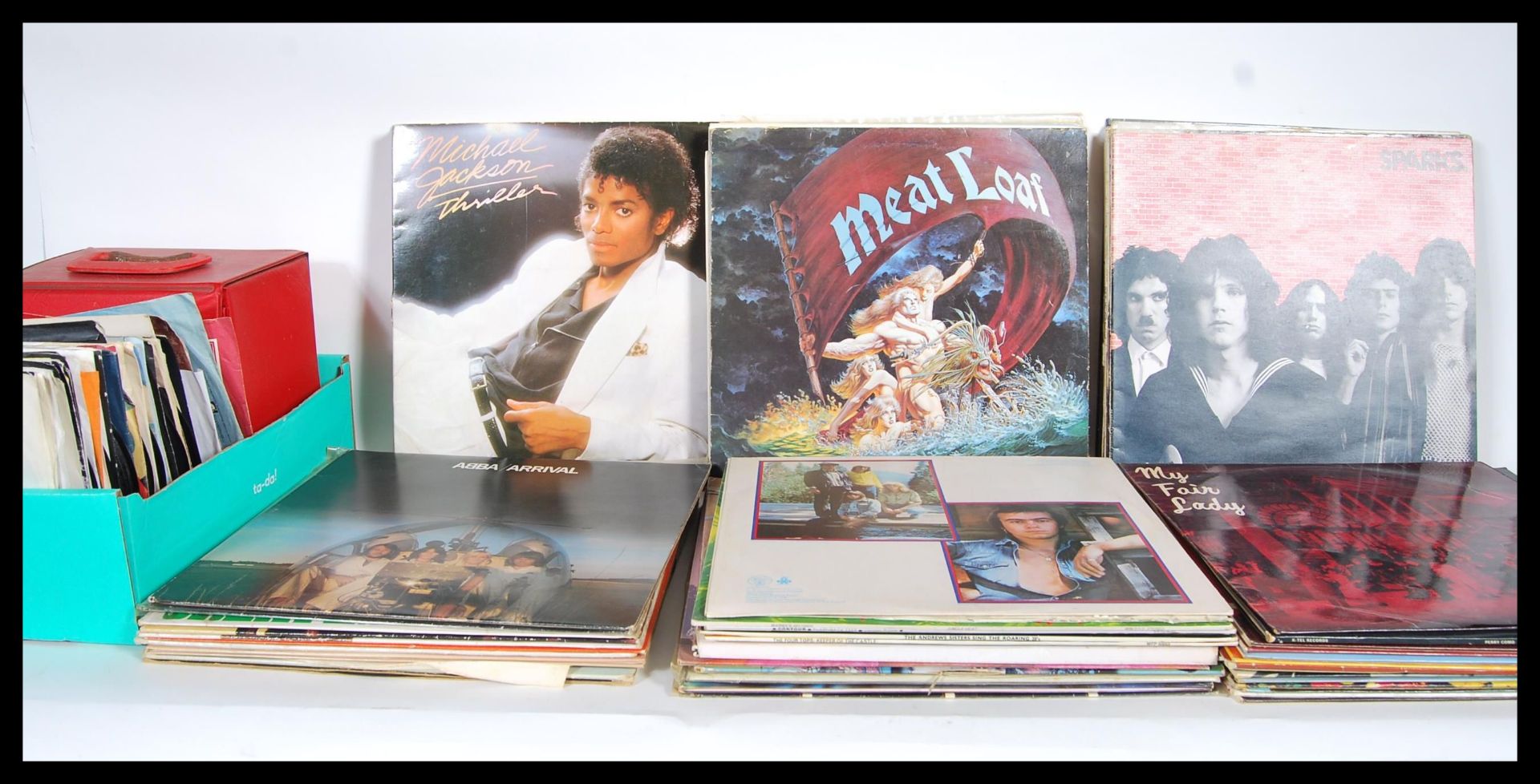 A collection of Vinyl LP and EP Records including 1980's hits, the Beatles Sargent Pepper's Lonely