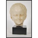 A 20th Century B.M. Replica ( British Museum ) resin composition head of Greek god Eros from the