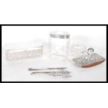 A selection of silver hallmarked dressing table items to include a Walker & Hall cut glass