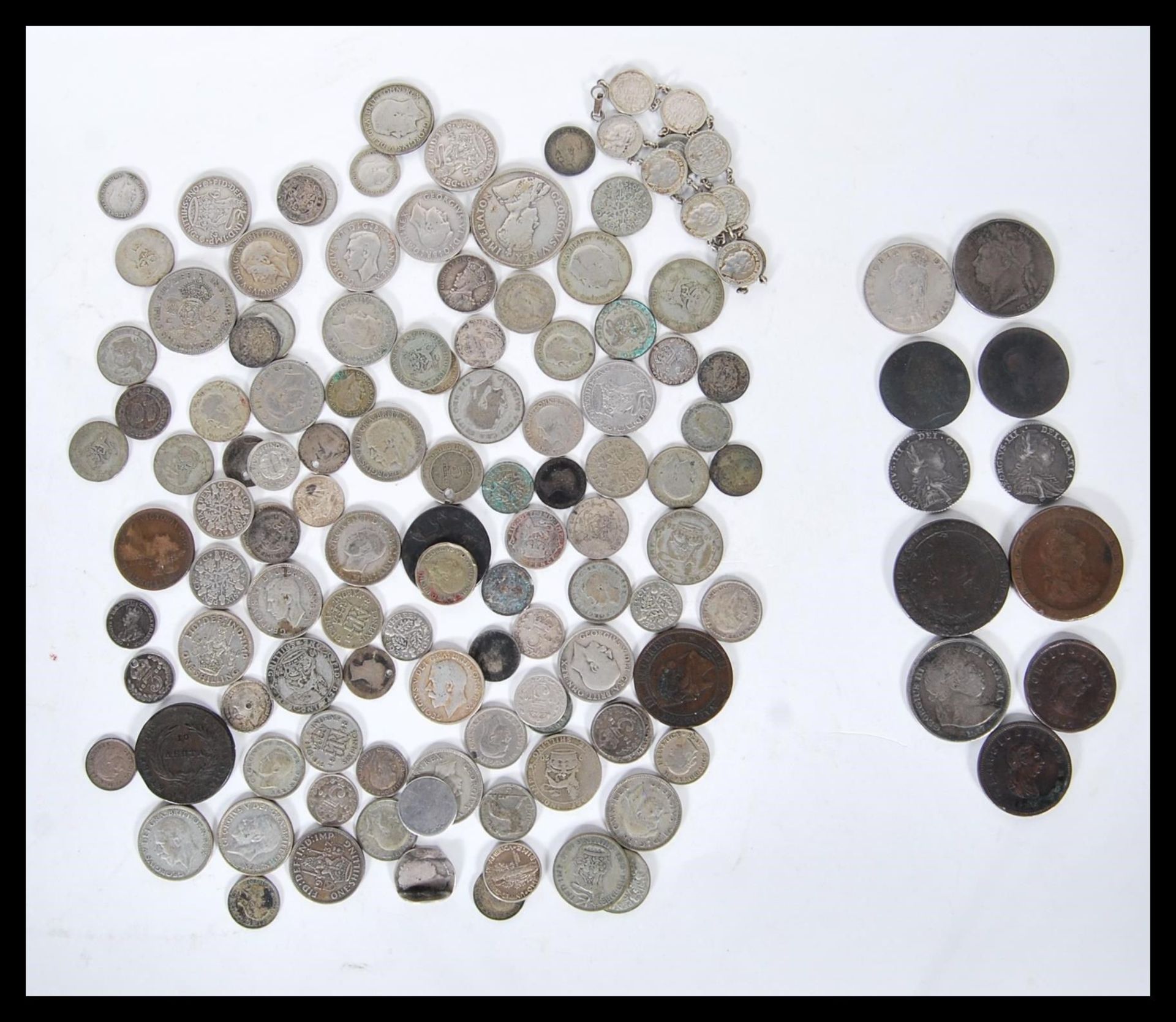 A collection of silver and copper coins dating from the 18th Century to include two 1787 George