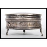 An early 20th Century Wright & Davies silver hallmarked dressing table box of round form having a