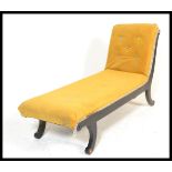 A 20th Century contemporary single scroll end chaise lounge in the Regency style being upholstered