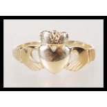 A 9ct gold hallmarked Welsh gold Claddagh ring. Hallmarked Birmingham. Weight 3.6g. Size X.5.