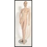 A retro 20th Century circa 1980's point of sale shop advertising display mannequin of female form