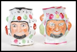 Two 19th Century prattware Satyr mask character jugs decorated with the face of Bacchus having