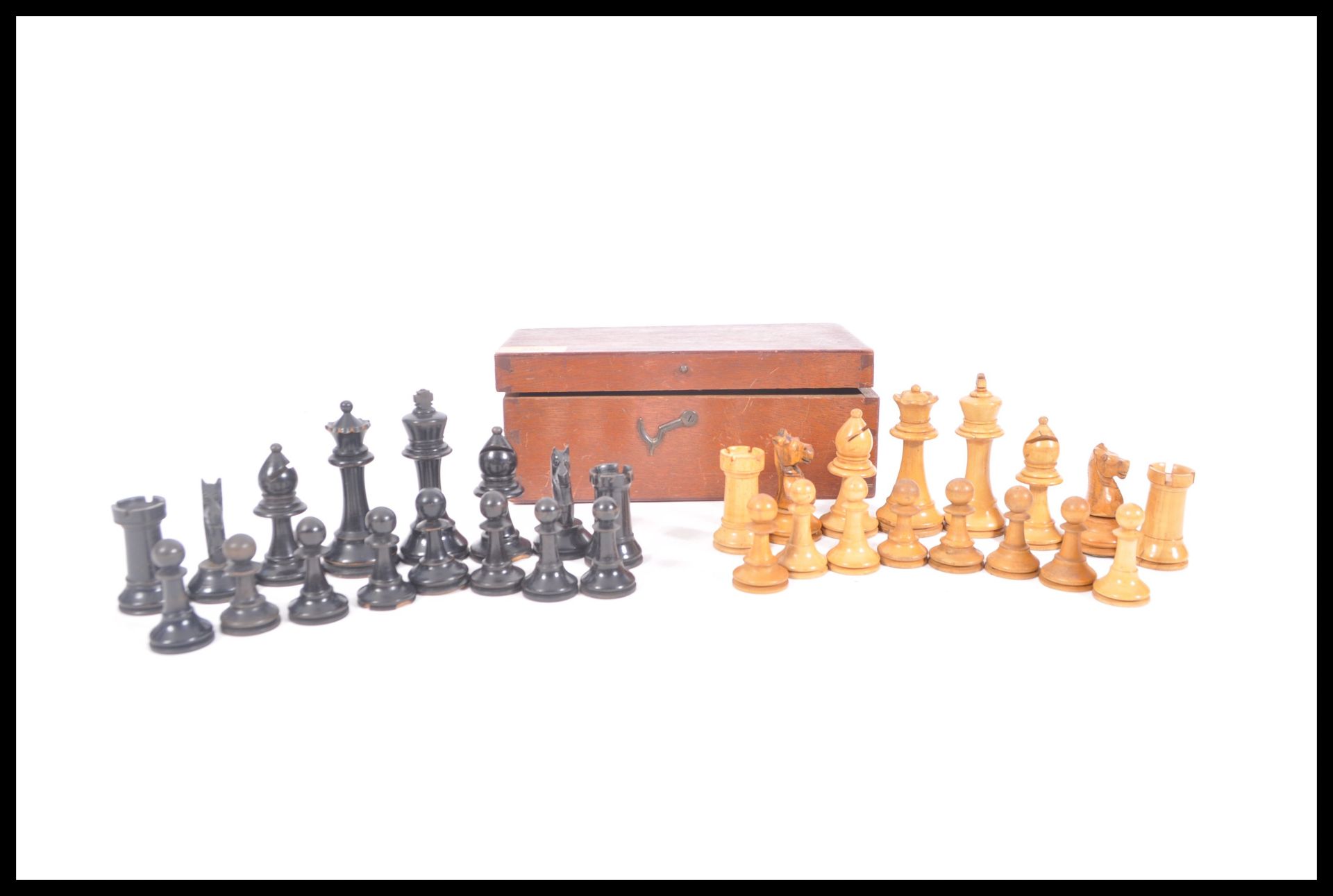 A vintage early 20th Century chess set having boxw