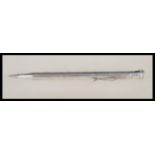 A 20th Century stamped sterling silver propelling pencil having engine turned decoration and