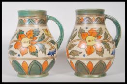 A pair of Art Deco Charlotte Reid for Crown Ducal handled vases of waisted form, pattern no. 5983,