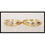 Two matching hallmarked 9ct gold rings both being gypsy set with cubic zirconia stones. Both