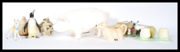 A collection of vintage 20th Century ceramics to include a large money box in the form of a pig, a