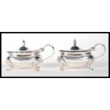 A pair of silver hallmarked Wilson & Sharp table condiments bearing Birmingham marks with date