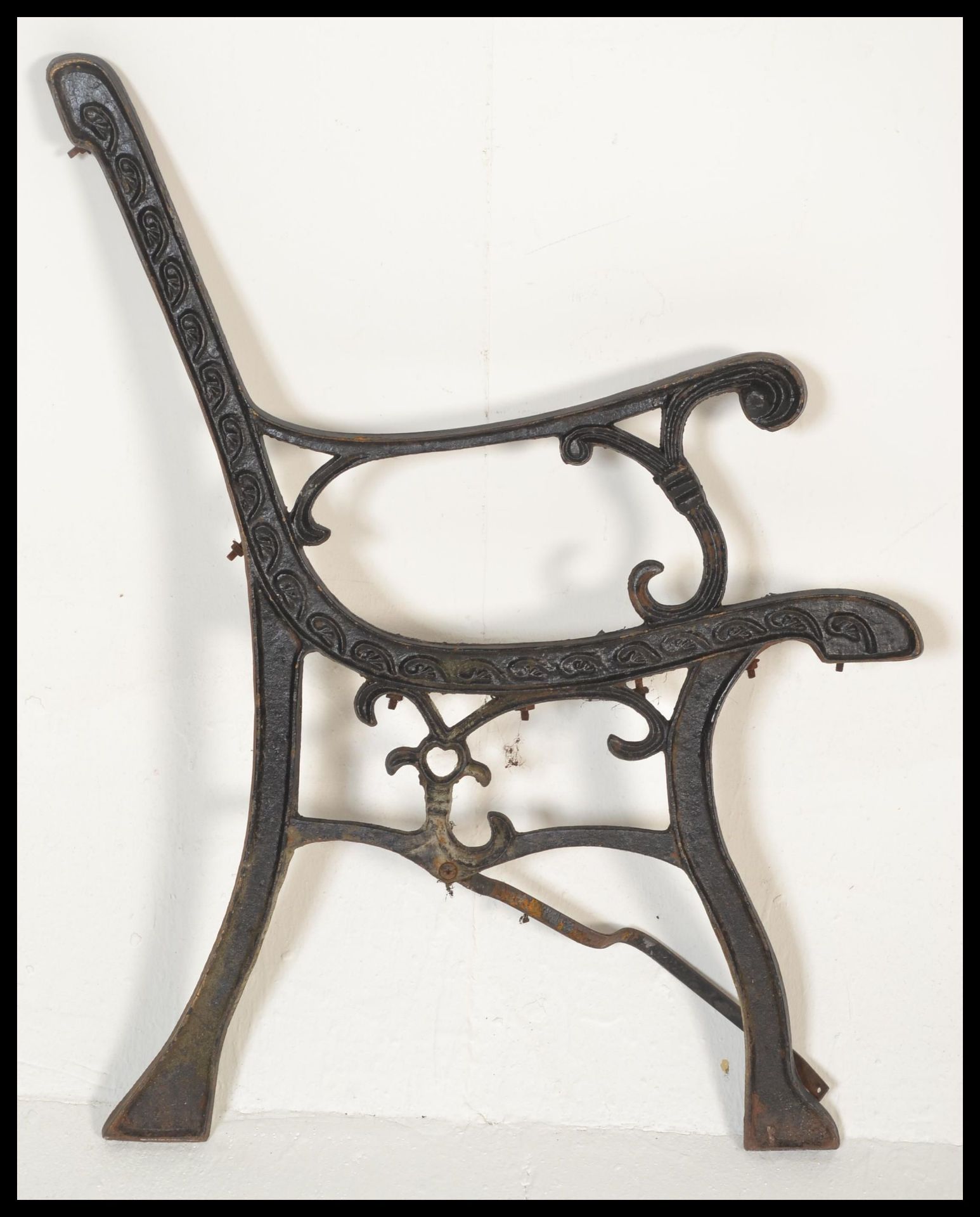 A pair of early 20th Century cast iron bench end finished in black. Together with a decorative - Bild 4 aus 7