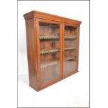 A Victorian large mahogany library bookcase cabinet having twin full length glazed panel doors