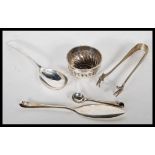 A group of silver hallmarked tableware items to include a condiment bowl (hallmarked Birmingham