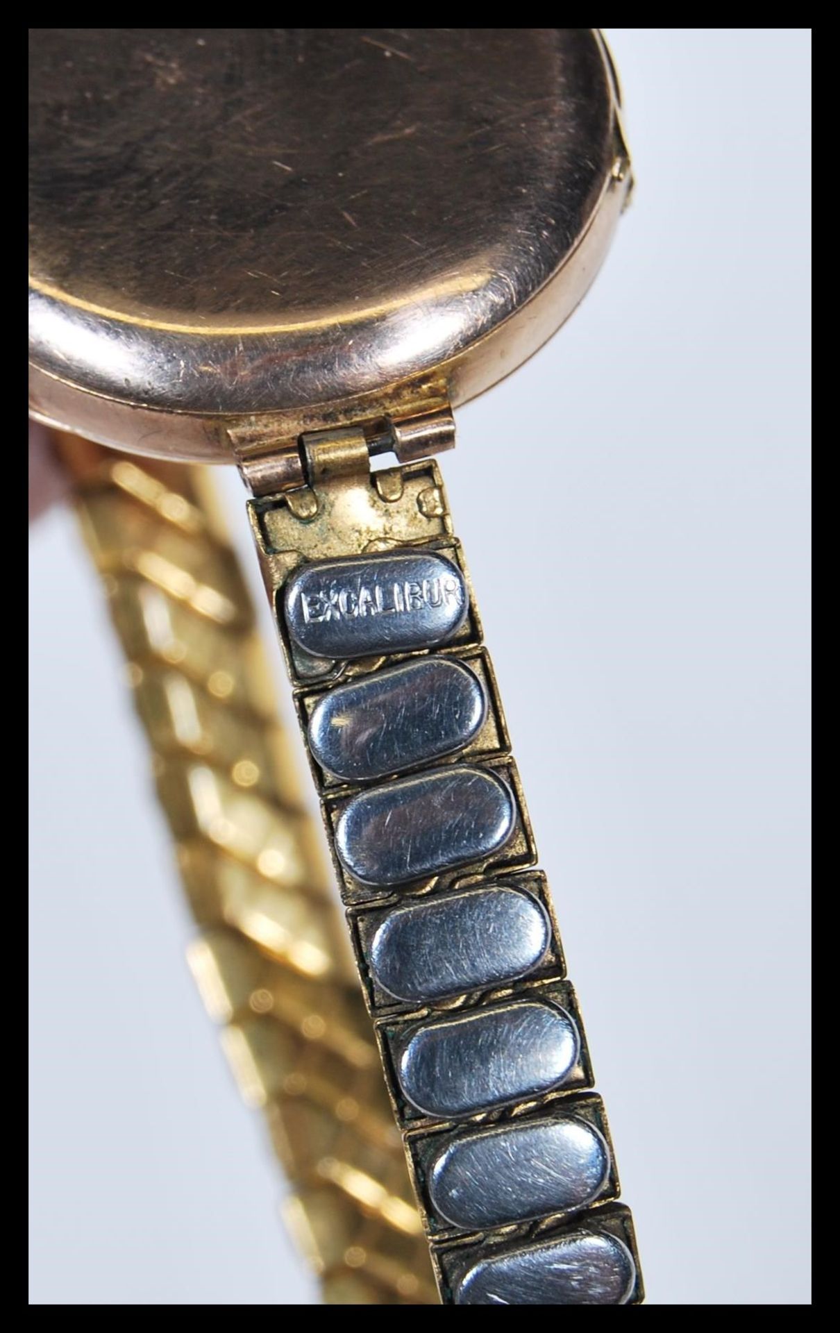 A 9ct gold ladies cocktail watch, enamel face with Arabic numerals, set to a gilt metal expanding - Image 6 of 10