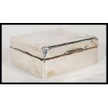 An early 20th Century Mappin & Webb silver hallmarked cigarette box having engine turned