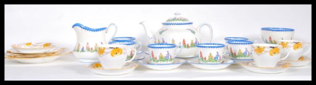 ). A 1930's Art Deco Grafton China part tea service to include cups, saucers, plates all being