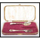 A mid 20th Century silver spoon and fork set within a vintage box. Makers marks for Viner's.