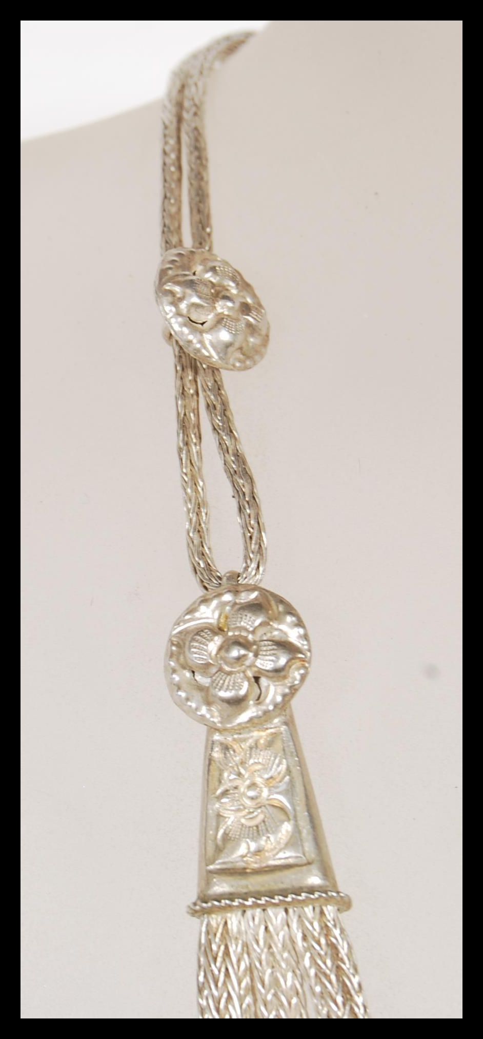 A 20th Century ethnic style silver necklace having three graduating snake chains with engraved - Image 3 of 5