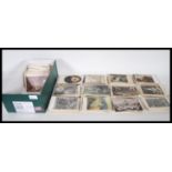 Subject postcards. Shoe-box with over 700 themed vintage non topographical postcards.