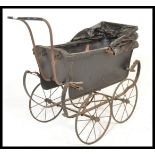 A 19th Century Victorian child's pram with metal lattice body on sprung chassis, with spoked wheels
