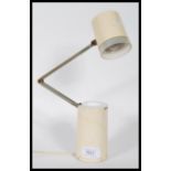 A vintage industrial Lloyds high intensity lamp model NA-101 constructed from a cream tubular body