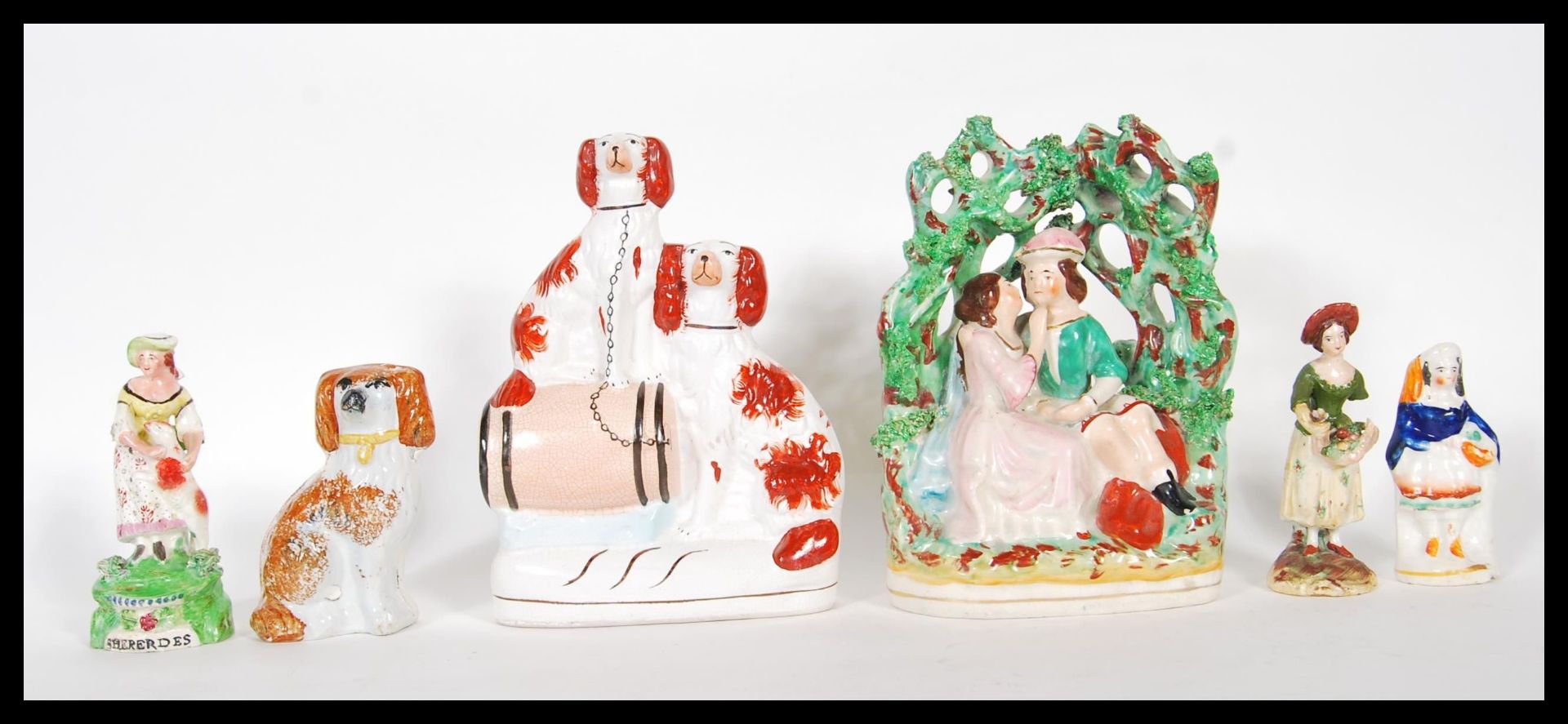 A selection of 19th Century Staffordshire flat back figurines to include a courting / just married