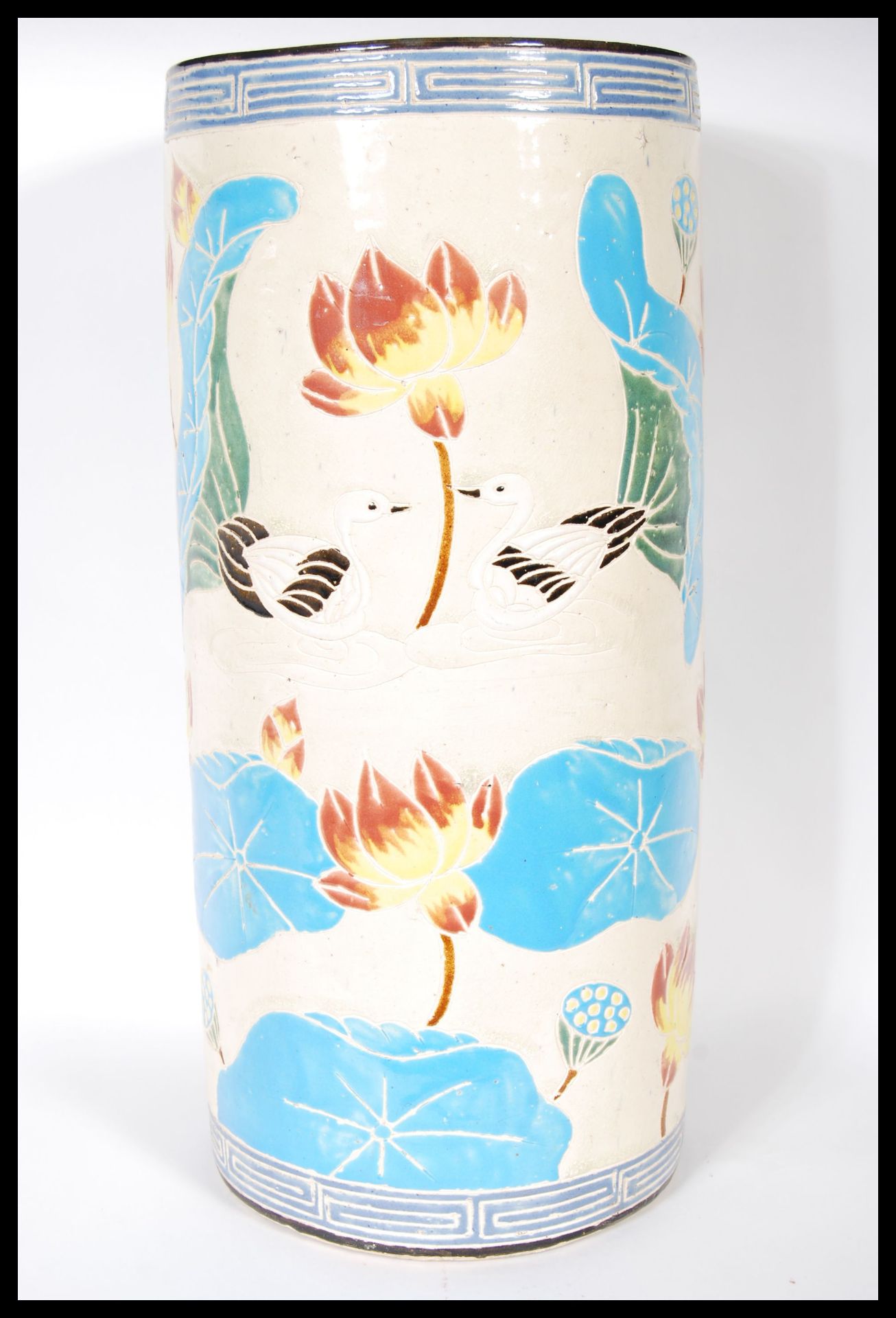 A 20th Century 1930's Art Deco Oriental ceramic cylindrical stick stand having lotus flowers, blue