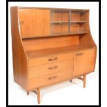 A 20th century retro teak wood highboard sideboard credenza, having a configuration cupboards and