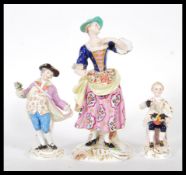 A Group of porcelain figurines to include a Crown Derby figurine depicting a Georgian lady with hand