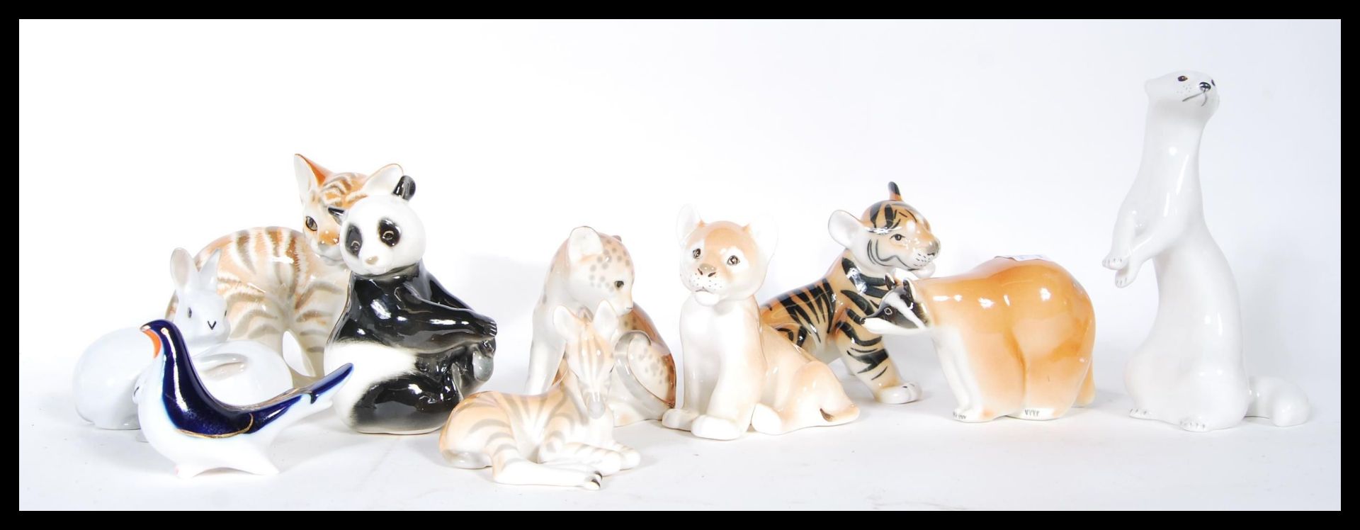 A collection of eleven vintage Russian USSR Lomonosov ceramic figurines of animals to include