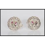 A pair of Versace style stamped sterling silver gentleman's cufflinks in the form of lion heads,