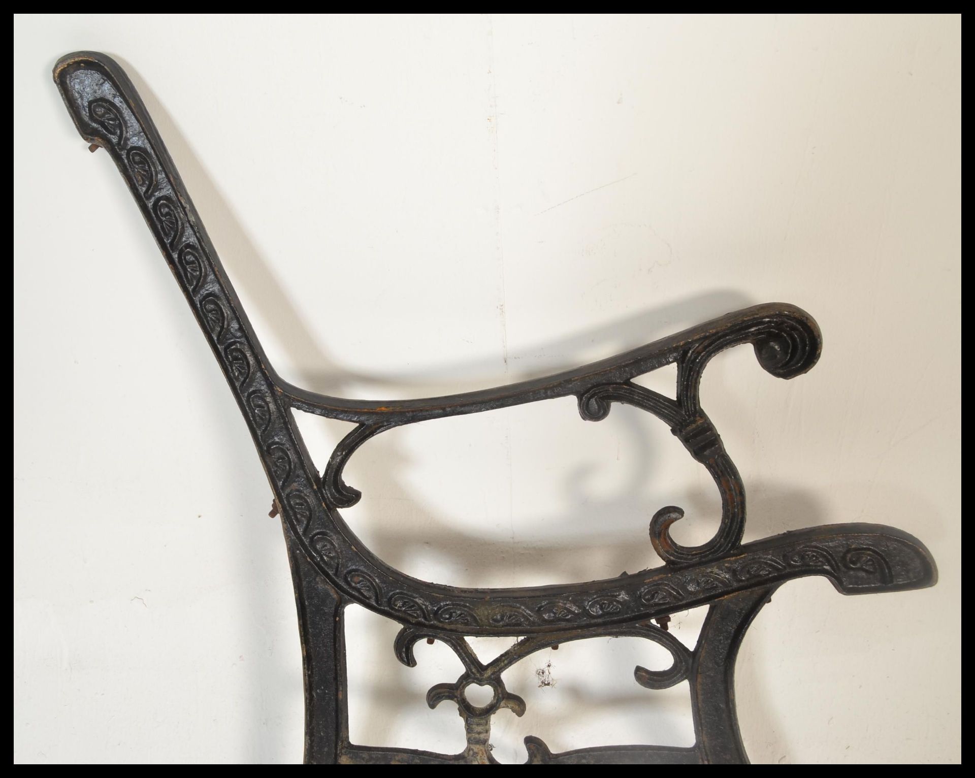 A pair of early 20th Century cast iron bench end finished in black. Together with a decorative - Bild 5 aus 7