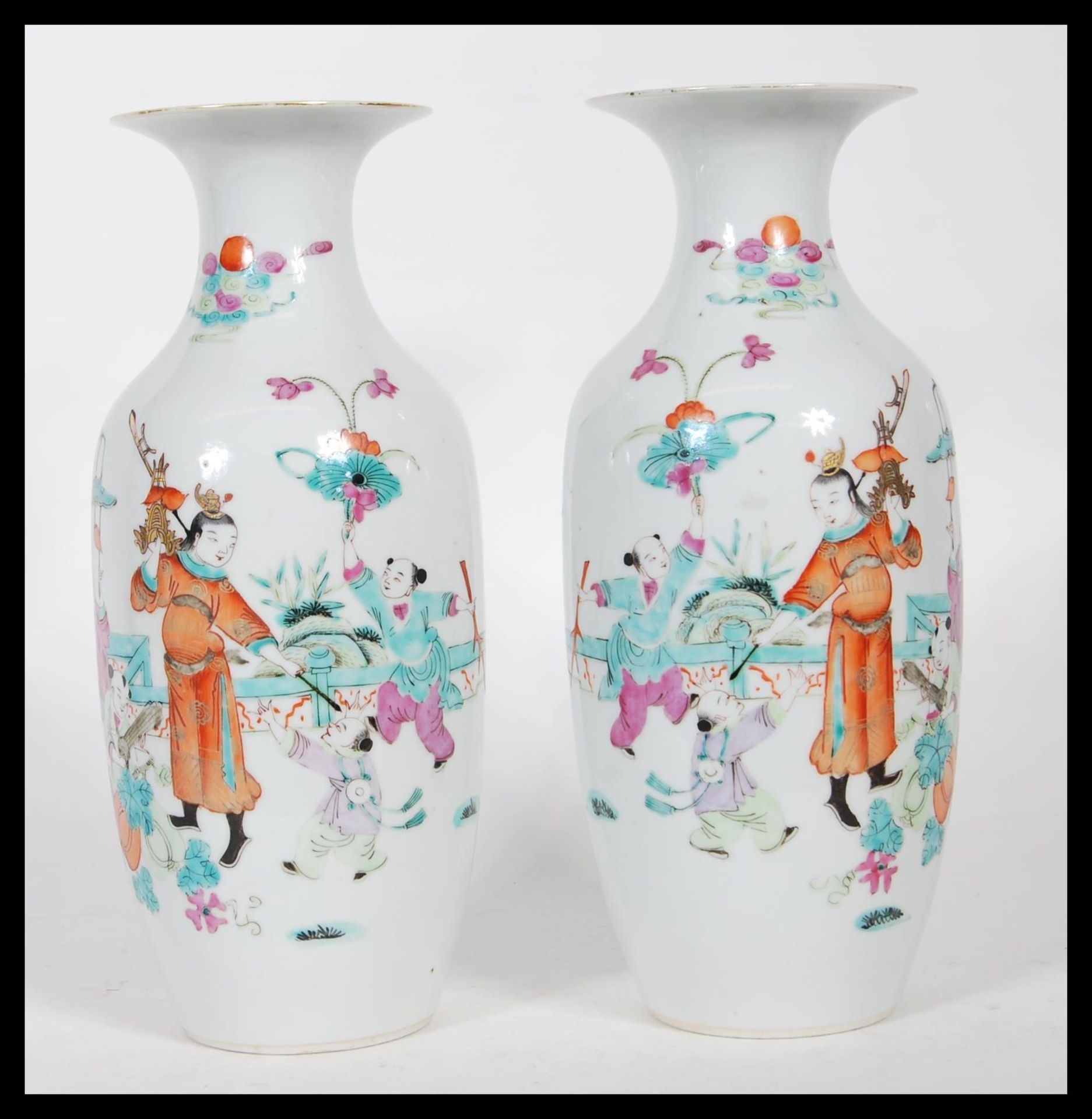 A matching pair of early 20th Century vases of baluster form, being hand painted decorated in