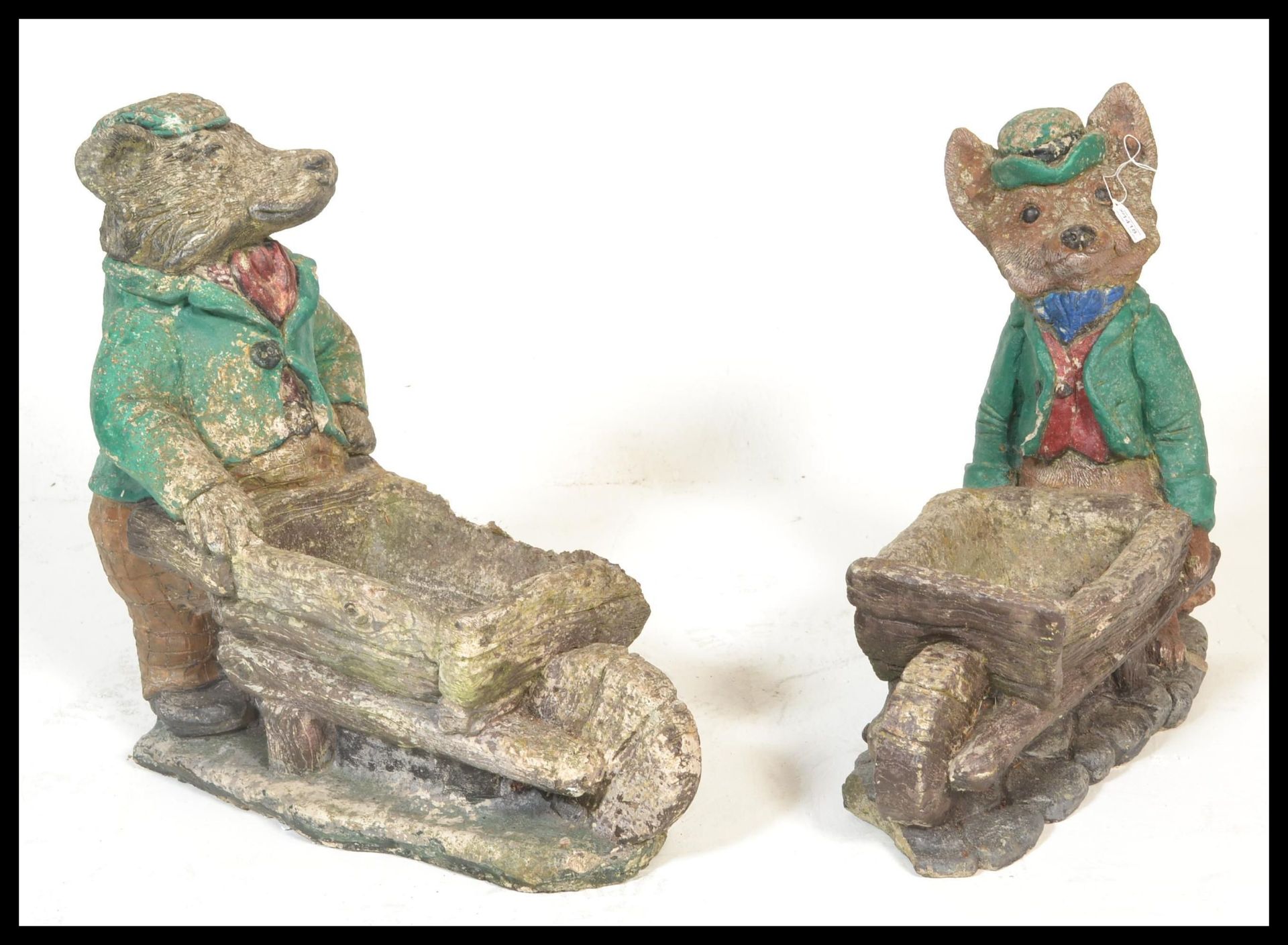 Two large 20th Century composite stone garden planters, one in the form of a fox and the other in