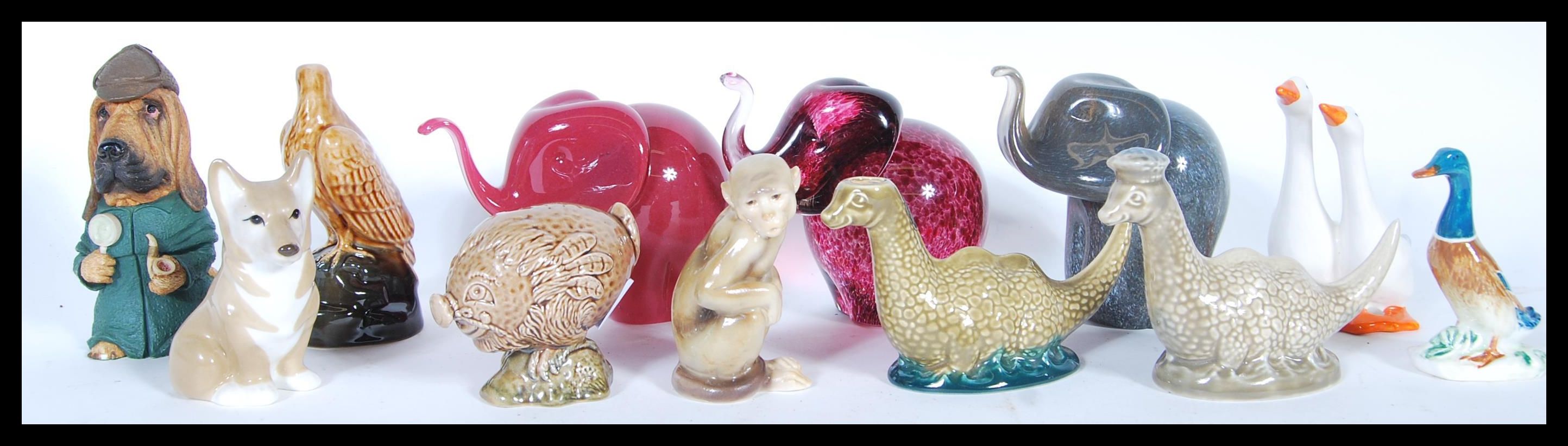 A collection of Beswick Small Whisky Decanters comprising Loch Ness Monster x 2, Flying Haggis