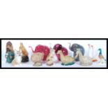 A collection of Beswick Small Whisky Decanters comprising Loch Ness Monster x 2, Flying Haggis