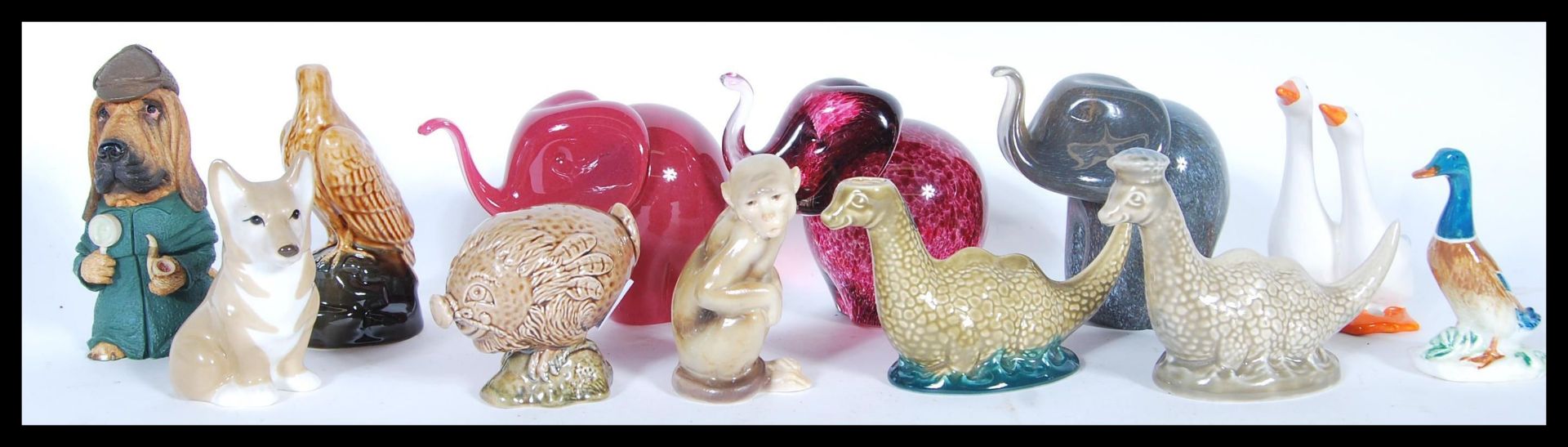 A collection of Beswick Small Whisky Decanters comprising Loch Ness Monster x 2, Flying Haggis