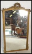 A late 19th century Napoleon III giltwood and gesso wall mirror with a rectangular plate and
