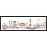 A large collection of silver plated items to include candlesticks, tray, serving dishes, tea