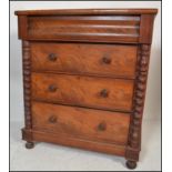 A Victorian mahogany barley twist Scottish chest of drawers. Raised on bun feet with a bank of